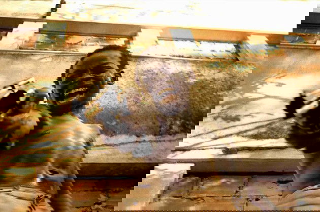 Dadinho con una pistola.