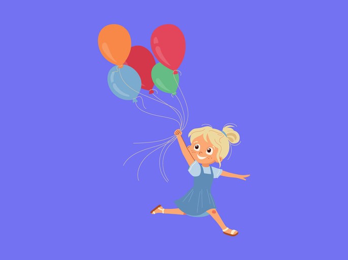 Niña feliz corriendo con globos