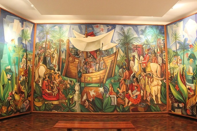 Painel Navio Negreiro, Di Cavalvanti. Retrata um navio chegando com negros em paisagem colorida