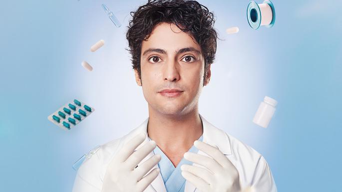 Homem jovem com jaleco e equipamentos de médico.